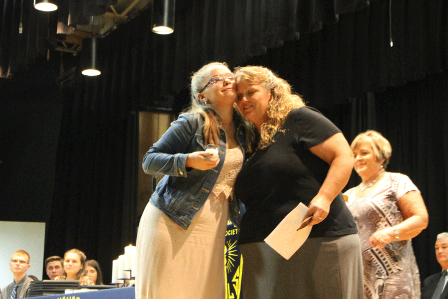 junior Makenzie Hensley is inducted into NHS by South School kindergarten teacher Roxanna Eckhoff. Hensley is known for being a great student with a great attitude.