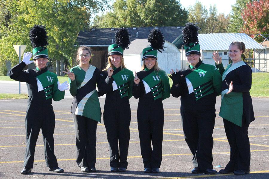 Seniors Zach Long, Amber Gillham, Jessica Kuykendall, Megan Brown, Ellie Register and Krystina Hensley celebrate together after their last marching band contest in Odessa.