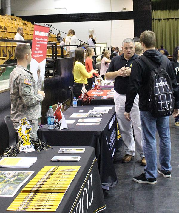 Senior Tyler Lynch Talks with a military recruiter. 