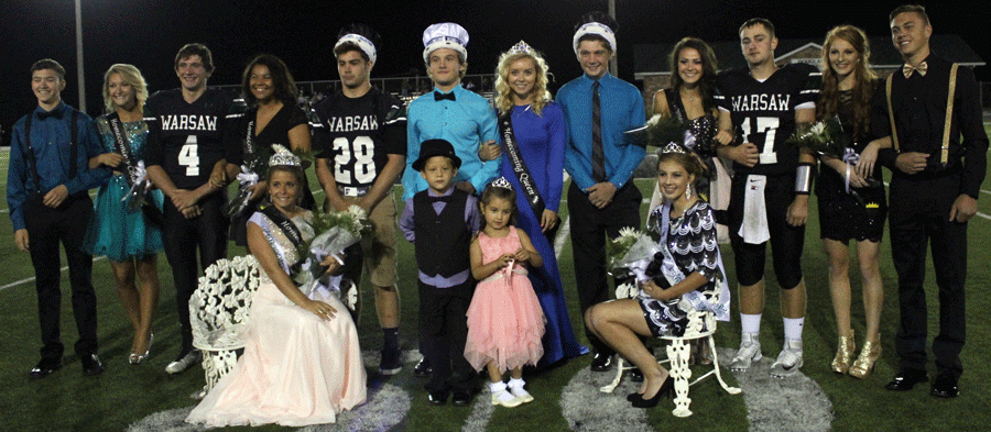 The Homecoming Court stands proud after coronation ceremonies Sept. 11. They included: (front row) senior queen Raven Caswell, crown bearer Bostyn Wilson, flower girl Maci Reimund, junior princess Ashlyn Yoder; (back row) seniors Thane Henderson, Payton Adair, Damian Adams, Keyona Davis, king Austin Steenburgen, 2014 king Ryan Todd, 2014 queen Megan Brown, junior prince Hunter Bagley, juniors Madison Grobe, Will Bunch, Sadie Friend and Cade Chiles. Yoder said the suspense was very exciting. Photo by Bridget Clarke.
