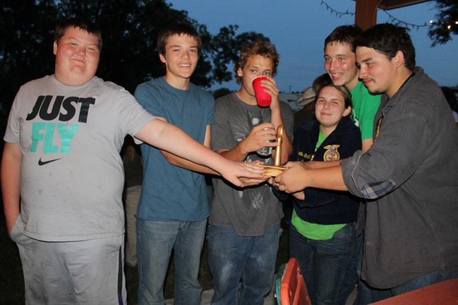 Sophomore King Archer, sophomore Eric Smith, senior Derek Wright, junior Alexis Smith, sophomore Rusty Johnson, and senior Shawn Riggs accept the trophy for winning the ice cream contest. The team worked outside of school to get the recipe right, taking about three times to get the flavor.
