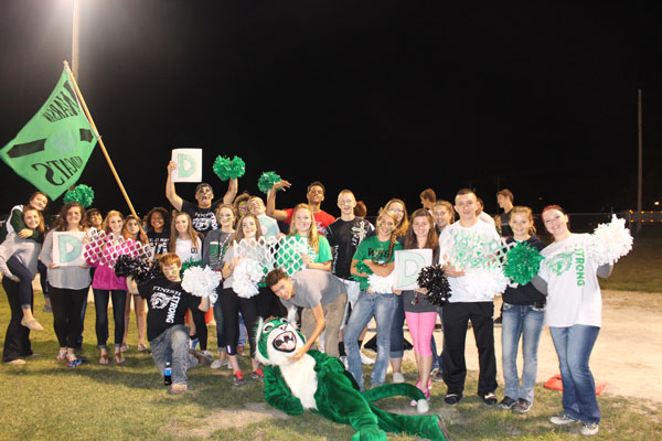 Wildcat Nation prepares to cheer for the football team during their game against Cole Camp. The boys lost 43-0.