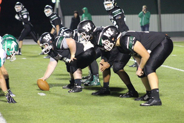 Players play their last home game against Blair Oaks with a loss of 57-0. Starting from the left: Logan Neth, Nate Fauquier, and Devin Coke. 
