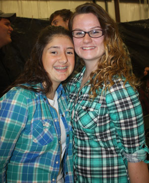 Juniors Erica Flores and Sam Thompson show their enjoyment of the Barnwarming dance. Barnwarming was held on November 13 in the Ag shop.
