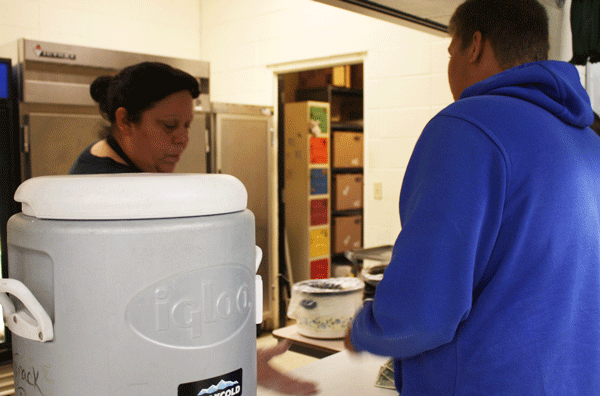 Junior Kendall Kee purchases an item from the Warsaw High School snack bar.
