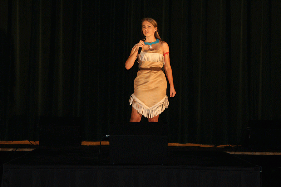 Ashlyn Yoder stands on stage dressed as Pocahontas.She performed Colors of the Wind. 