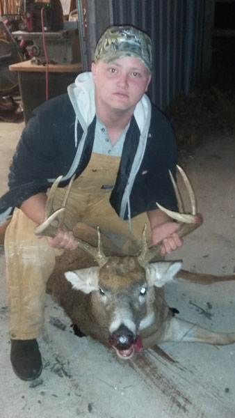 Sophomore Glenn Elliott holding the eight point buck he shot this year. This was Elliott's first deer he has shot. -Photo Submitted
