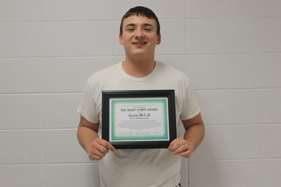 Senior Austin McCall holds his award with a big smile. He is only the second person to obtain this award. 