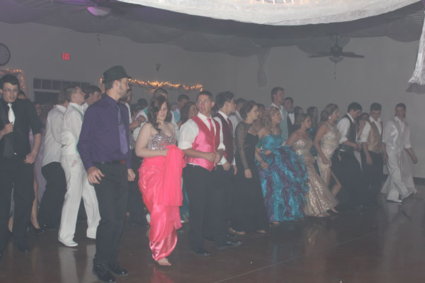 Seniors Stephanie Blake, Shyla Estes, Raven Caswell and Kaitlyn Laue dance in their Prom attire at last year’s event. 