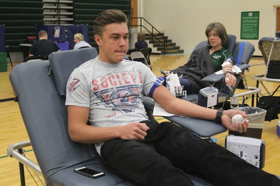 Junior Cade Chiles waits to donate blood for the blood drive. This year the blood drive collected 75 whole blood donations. 3-4-16 Photo by Destiny Lee.
