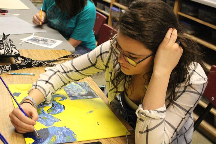 Junior Rebecca Letcher works on a painting of “Starry Night.” She has been in an art class since freshman year. 