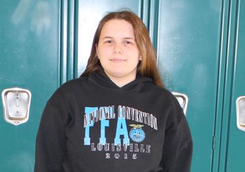 Junior Alexis Smith stands in front of the lockers in the school she knows so well.  Smith is this months high school hero. 