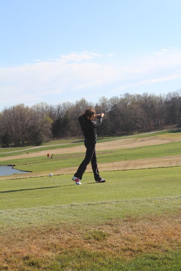 Junior Madi Grobe tees of at the home match on April 5. Grobe scored  56 