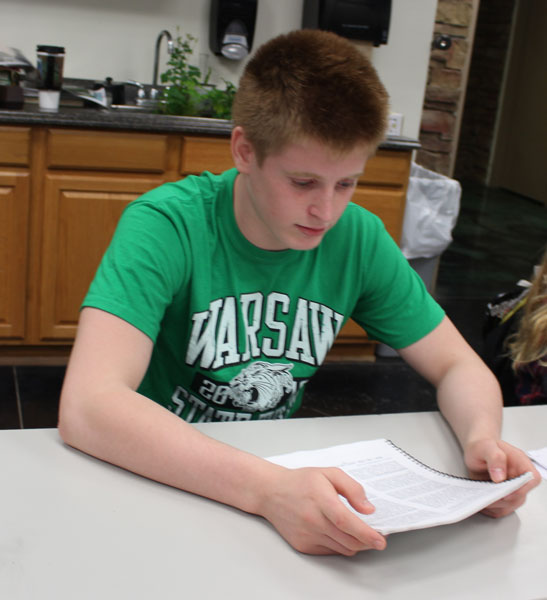 High school hero Kolby Estes reads from his meats book in his Ag I class. Along with FFA, Estes is also involved in wrestling, pep club, and finance club.
