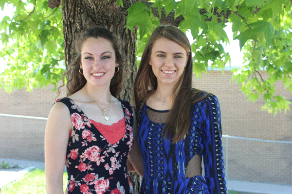 Rickie Branson and Claudia Schmitz stand in the courtyard outside of the choir room. Both girls were nominated as the top math students of their class.
