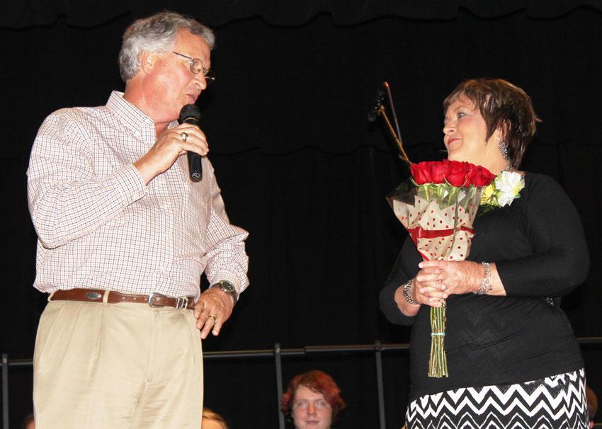 Retired North Elementary principal John Carelton honors Charlene Million with memories. 