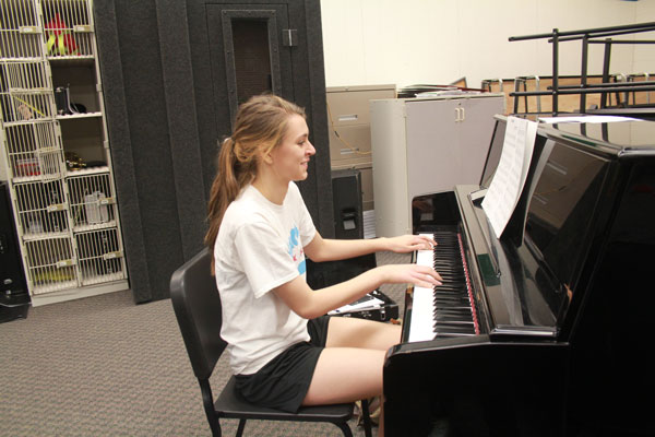 Senior Claudia Schmitz practices her solo for state in Jazz Band. 