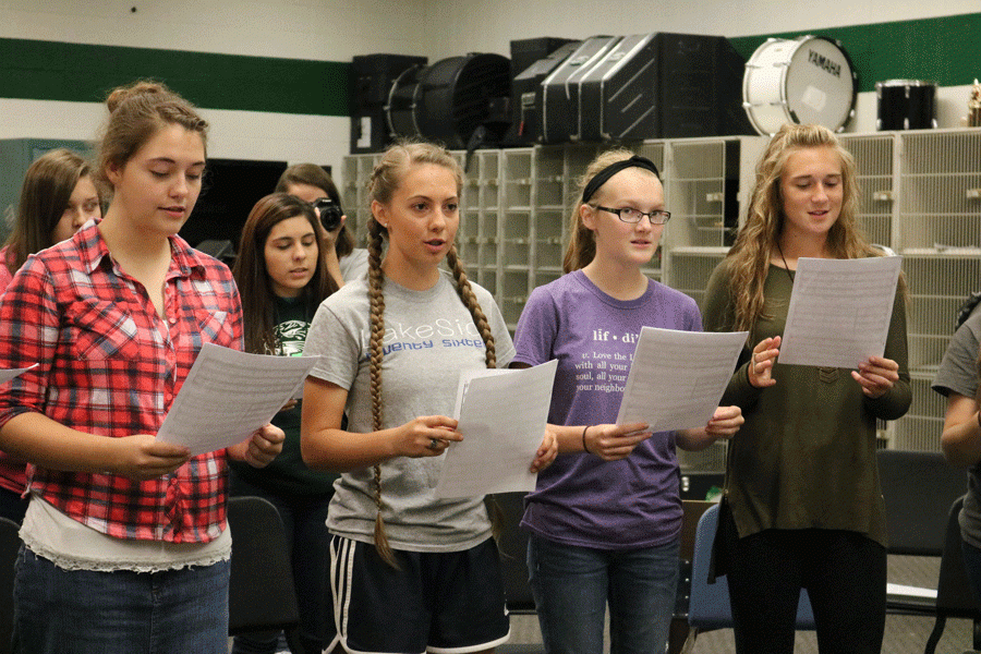 Sophomore Allison Thomas, senior Ashlyn Yoder, freshman Madeline Schockmann, and Aubrie McRoberts practice music for the upcoming musical Oklahoma. Yoder will be portraying Laurey, Schockmann will be portraying Ellen, Thomas and McRoberts will be performing in the chorus.    