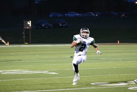 Junior wide receiver/cornerback Jayden Schepker runs the ball down the field during a game against Osage. The Wildcats fell to the Indians 42-6. 