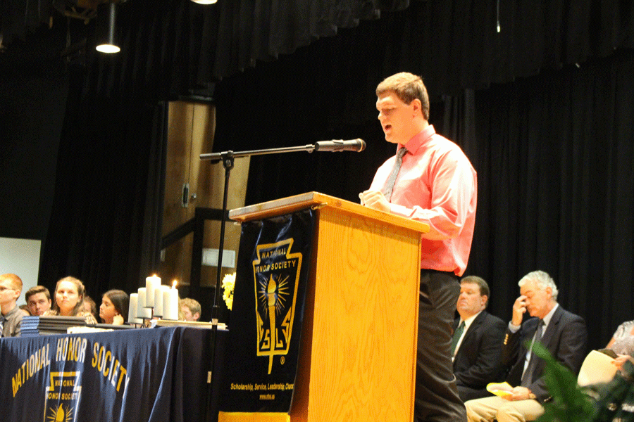 NHS President Blake Broderson introduces the officers to the students, staff, and inductees. There are six officers that make up NHS. 
