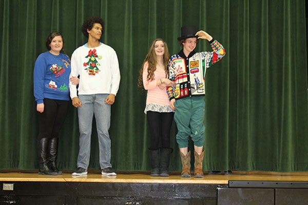 Below: Seniors Kaci Cooner, Wesley Carr, Hannah Chapman and Noah Long face off in the 2015 Mr. Christmas Prince contest at the holiday assembly. Carr, the 2015 prince winner, said he will participate again this year. 