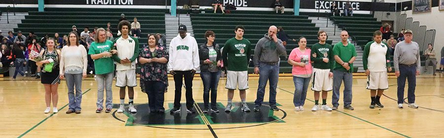 Senior players stand with their parents during senior night. Senior night was held on Tuesday, Feb. 14. 
