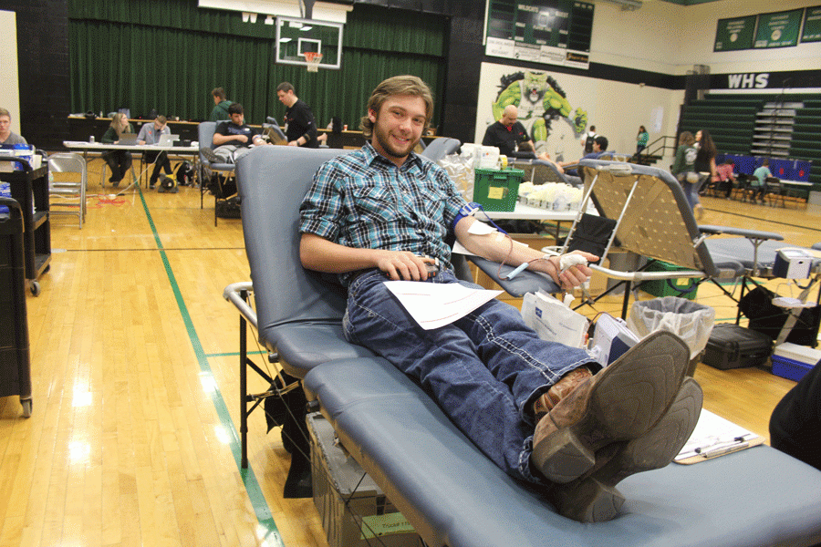 Senior+Hunter+Bagley+gets+his+blood+drawn+at+the+annual+WHS+blood+drive.+This+year+marks+his+second+year+of+donating+his+blood%2C+and+his+experience+was+good+until+nearly+passing+out.