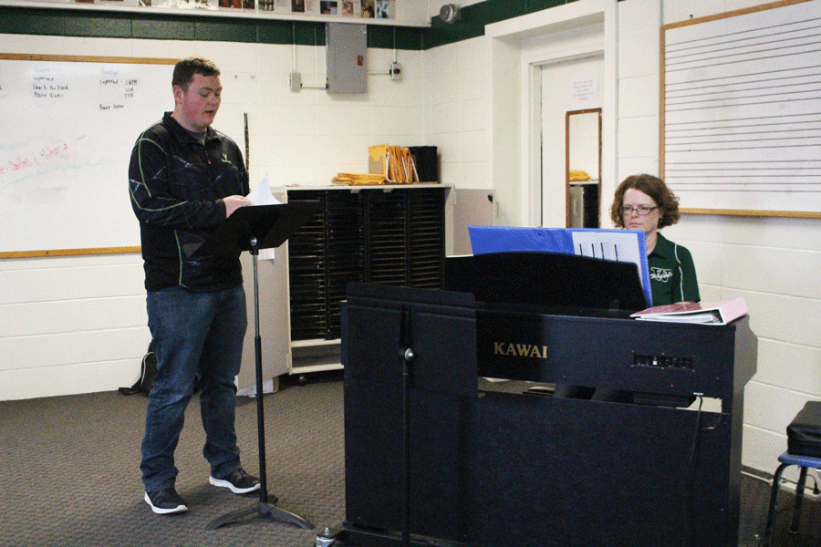 Senior Seth Eckhoff rehearses his solos pieces with choir director Deanna Schockmann. Eckhoff is going to state contest after receiving a “1” rating at district contest.