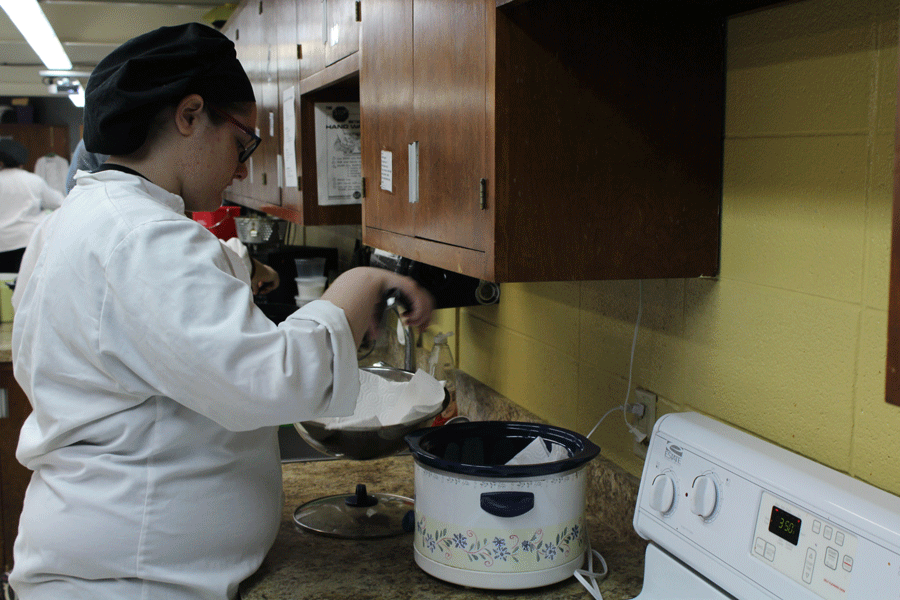 Senior Amee Wiggins cooks hush puppies in prostart 2. The class did a fish fry for the principals from the Tri-County Conference. Wiggins feels she would not have been able to accomplish the things she has accomplished without the help of her foster mom, Brandi Fajen. Photo by Maddie Freeman.