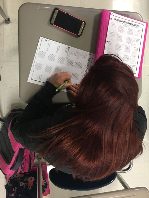 Junior Brandi Hubert practices for the first Algebra II test of the year. Despite studying in algebra, her favorite class was actually English.