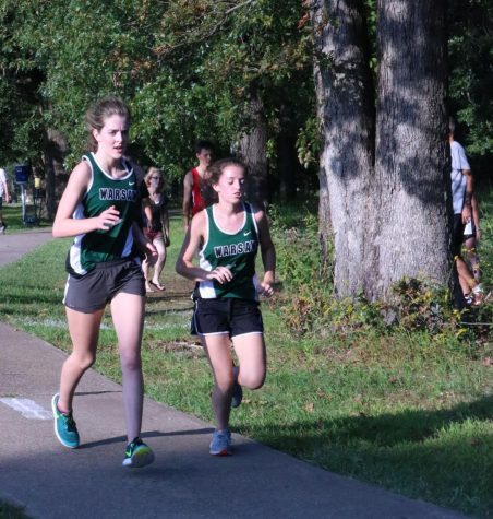 Senior Hannah Chapman, and junior Autumn Long compete at Stockton. Chapman and Long run together to push each other to do better, and work harder to beat their own scores.
