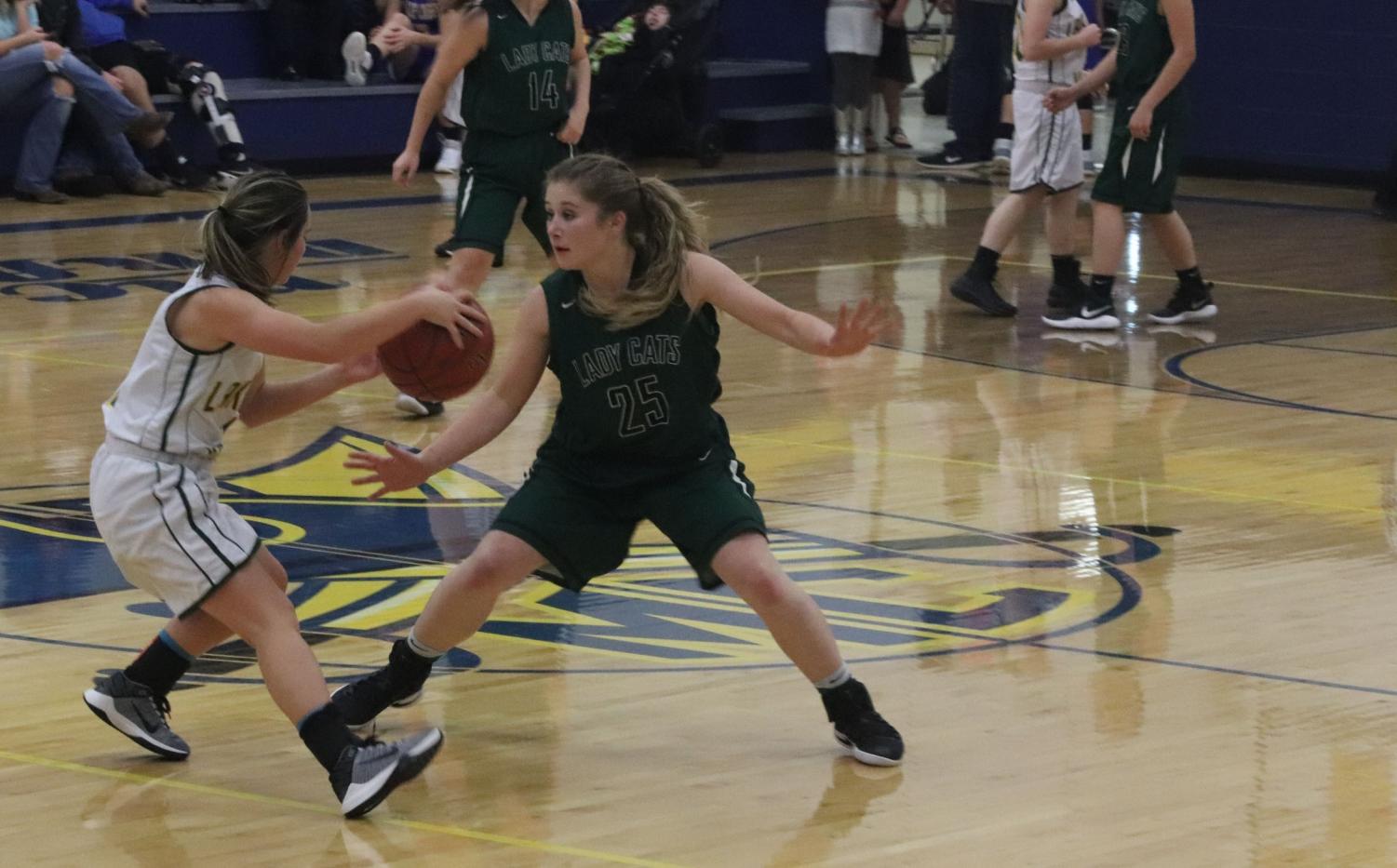 Freshman Kylee Fajen plays defense at the girls first Jamboree. They won their six minute quarter against Lakeland. Photo by Rheanna Coke