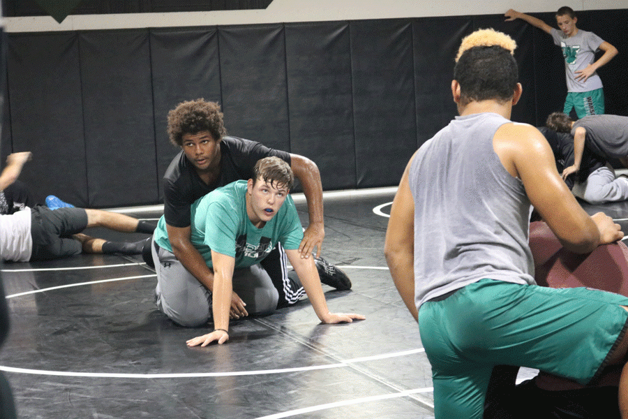 Senior+Nate+Fauquier+and+freshman+Colby+Stephens+practice+new+moves+for+upcoming+meets.+This+is+Stephens+first+year+wrestling+and+Fauquiers+fourth.+
