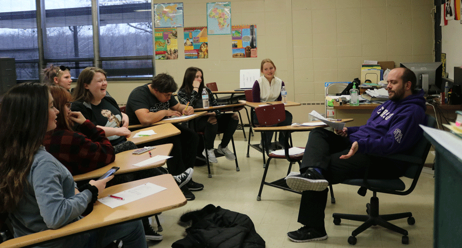 Academic team members, freshman Gabby Porter, sophomore Alexa Scrivener, senior Caitlin Easter, sophomore Kane Culbertson, freshman Hayley Dwyer, sophomore Kathryn Rickie listen to advisor Nathan Copling during practice.