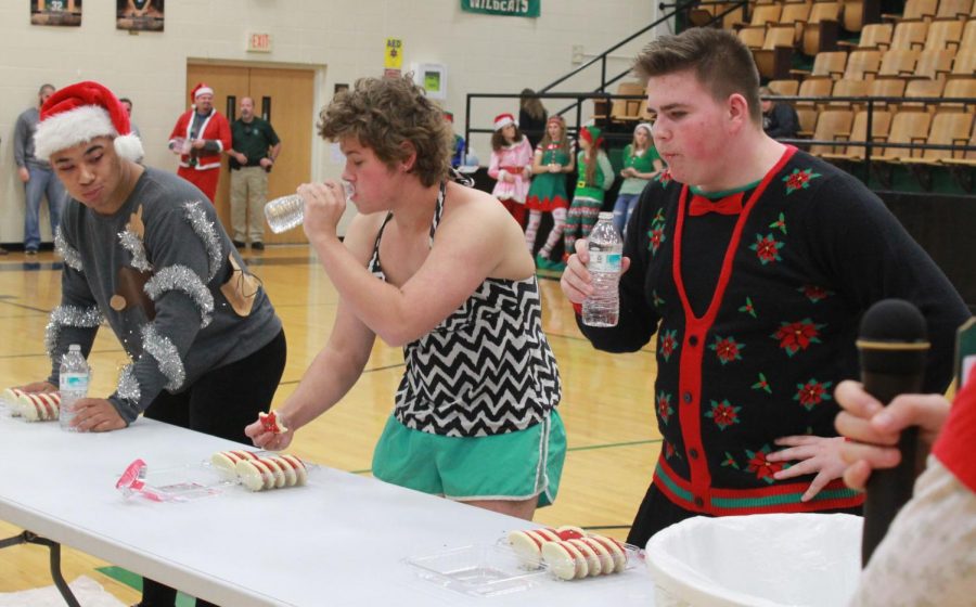 Juniors Keion Davis, Connor McLaughlin, and Mikey Wetro participate in the prince candidate game. The game was to eat the the whole box of cookies first. Keion Davis was the winner of the prince game.