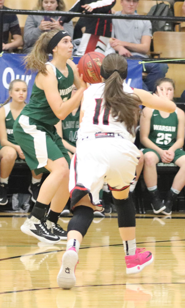 Sophomore Aubrie Mcroberts shooting three pointer at the Warsaw Wildcat tournament against Conway. Mcroberts shot in the fourth quarter. The Wildcats lost the game by two points but continued to kept playing in the tournament.
