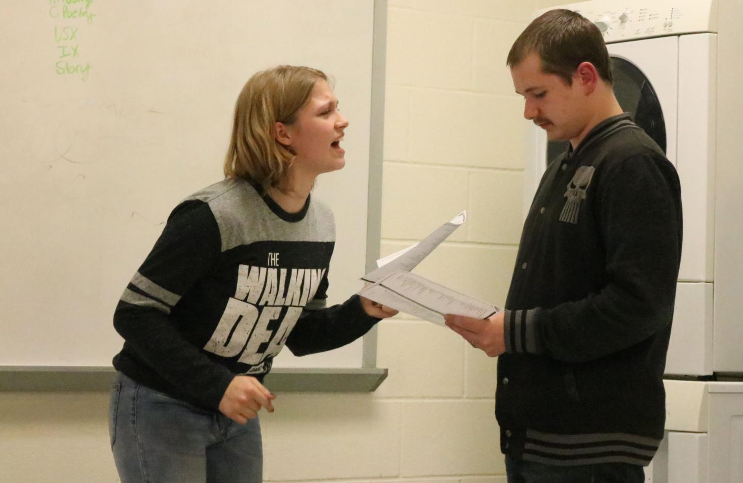 Freshman Lacey Andrews and sophomore Tristan Good practice there skit they had been working on at speech team practice. They preformed this act for there fellow members of speech team.