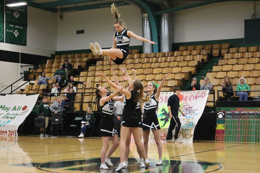 Warsaw cheerleaders perform their first stunt indoors for the Courtwarming assembly. The cheerleaders hosted many performances during the assembly held on Feb 2.