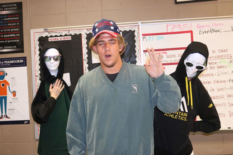 Sophomores Rayni Simons, Austin Rosser and Kiersten Grobe remain in character throughout meme day. Simons and Grobe dressed with mannequin heads while Rosser spent his day impersonating president Donald Trump.