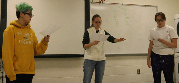 Sophomores AJ McMillen, Kathyrn Ricke, and Alexa Scrivner are practicing on their roles for readers theater. They will perform their piece on March 2nd.