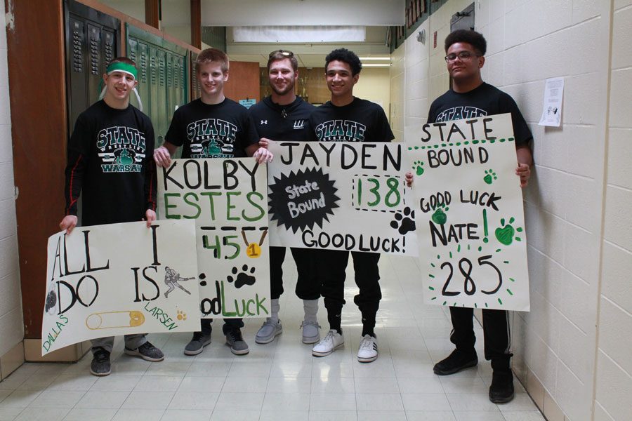 Wrestlers walk the halls as they head for state