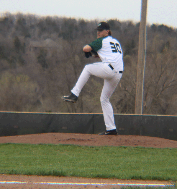 Senior Cash Miller pitches at the first home game of the season. Miller pitched against Blair Oaks in the 2nd inning. 