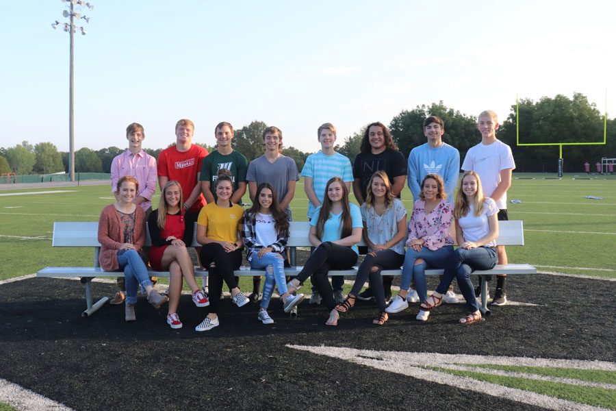 Homecoming candidates prepare for Friday night coronation on Randy Morrow Field. They include, (front row) princess candidates, juniors Payge Adair, Kiersten Grobe, Ally Wenberg, Ashten Cunningham, queen candidates, seniors Helena Givens, Suzy Cortright, Rylee Pals and Jessie Glenn; (back row) prince candidates, juniors Zach Chapman, Lane Bates, Matt Couzens, Chase Steiner, king candidates, seniors, Ethan Schomburg, Eli Hawkins, Joey Mace, Jesse Johnson. Photo by Ally Estes.