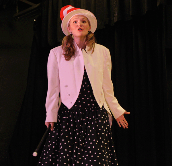 Junior Madeline Schockmann sings during the performance of "Seussical". Schockmann portrayed the iconic character of the Cat in the Hat.