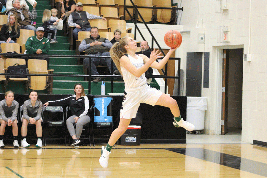 Junior Aubrie McRoberts takes it to the hoop. McRoberts has been on the varsity team for two years. 
