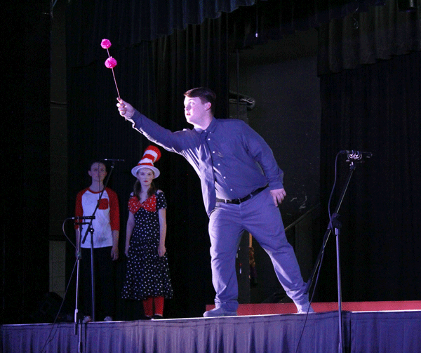 Sophomore Grady Miller presents the clover containing a speck of dust to the audience. Millers character, Horton, was a lonely elephant who endured bullying in order to save the town of Whoville tucked away within the speck of dust. The play was performed Nov. 2-4 .