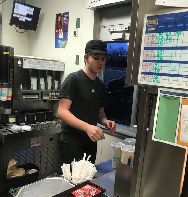 Senior Ethan Schomburg prepares drinks at McDonalds.