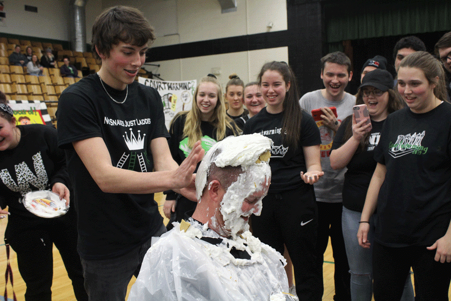 Senior Logan Davis smashes a plate full of whipped cream on principal Danny Morrison’s head. The senior class won Spirit Week and was rewarded by putting pies in the principal’s face.