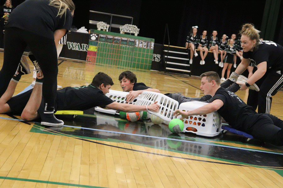 Seniors Riley Bagley, Logan Davis, Maleek Porter and Taylor Bunch compete in the Courtwarming candidate game. The theme for the game was inspired by “Hungry Hungry Hippos.”