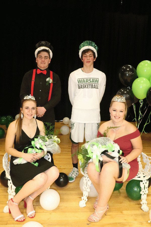 Courtwarming royalty take their thrones. They included (front row) junior Aubrie McRoberts as princess and senior Taylor Bunch as queen; (back row) junior Aiden Comer as prince and senior Logan Davis as king. Coronation for Courtwarming was held on Feb. 8.